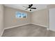A vacant bedroom with wood-look floors, a ceiling fan, and a window at 608 W Mcdermit St, Las Vegas, NV 89107