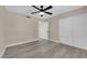 A vacant bedroom with wood-look floors, a ceiling fan, and a closet at 608 W Mcdermit St, Las Vegas, NV 89107