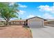 Charming single-story home with a spacious two-car garage and mature shade tree in front at 608 W Mcdermit St, Las Vegas, NV 89107