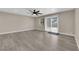 Spacious living room with sliding glass doors leading to the backyard, filled with natural light at 608 W Mcdermit St, Las Vegas, NV 89107