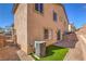 Spacious backyard showcasing a small turf area, patio, and privacy fence at 632 Twilight Blue Ave, North Las Vegas, NV 89032