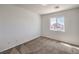 Bright, carpeted bedroom with large window at 632 Twilight Blue Ave, North Las Vegas, NV 89032