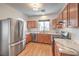 Spacious kitchen features stainless appliances, marble countertops, and natural light at 632 Twilight Blue Ave, North Las Vegas, NV 89032