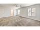 Bright main bedroom featuring large windows and plush carpeting at 632 Twilight Blue Ave, North Las Vegas, NV 89032
