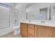 Bathroom featuring a double sink vanity, shower, and tile flooring at 648 Sumatra Pl, Henderson, NV 89011
