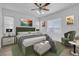 Bedroom features a ceiling fan and stylish furnishings, including a green velvet bed at 648 Sumatra Pl, Henderson, NV 89011
