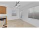Dining room features large windows, tile floor, chandelier and access to the backyard at 648 Sumatra Pl, Henderson, NV 89011