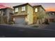 Two-story home with a two-car garage, desert landscaping, and a charming entryway at 648 Sumatra Pl, Henderson, NV 89011