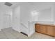 Hallway features neutral tile flooring, fresh white paint, and built-in storage at 648 Sumatra Pl, Henderson, NV 89011