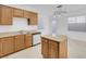 Eat-in kitchen features granite countertops, stainless dishwasher and access to the backyard at 648 Sumatra Pl, Henderson, NV 89011