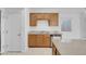 Kitchen features wood cabinets, stainless dishwasher and sink, granite countertops and kitchen island at 648 Sumatra Pl, Henderson, NV 89011