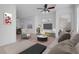 Stylishly staged living room with modern furniture and a ceiling fan at 648 Sumatra Pl, Henderson, NV 89011