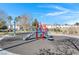 Community playground features a colorful slide and climbing structure, inviting children to play in a safe environment at 648 Sumatra Pl, Henderson, NV 89011