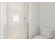 Bright bathroom featuring a glass-enclosed shower and a toilet at 6489 Coldwater Bay Dr, Las Vegas, NV 89122
