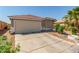 Charming single-story home featuring a tile roof, two-car garage, and well-maintained landscaping at 6489 Coldwater Bay Dr, Las Vegas, NV 89122