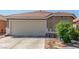 Close up of the garage door and front facade of this single-story home with xeriscaping at 6489 Coldwater Bay Dr, Las Vegas, NV 89122
