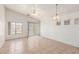 Bright, airy living room featuring tile floors, a ceiling fan, and large windows with blinds at 6489 Coldwater Bay Dr, Las Vegas, NV 89122