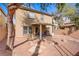Inviting backyard featuring a covered patio, rock garden, and a privacy fence at 6625 Pine Siskin Pl, North Las Vegas, NV 89084
