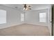 Spacious bedroom with natural light and neutral carpet, creating a serene and inviting atmosphere at 6625 Pine Siskin Pl, North Las Vegas, NV 89084