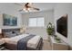 Staged bedroom featuring a comfortable bed, stylish decor, and modern furnishings, creating an inviting space at 6625 Pine Siskin Pl, North Las Vegas, NV 89084