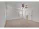 Spacious bedroom with natural light and neutral carpet, creating a serene and inviting atmosphere at 6625 Pine Siskin Pl, North Las Vegas, NV 89084