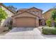 Charming two-story home with a two-car garage and desert landscaping for easy maintenance at 6625 Pine Siskin Pl, North Las Vegas, NV 89084
