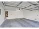 Spacious garage with water heater and ample space for parking and storage at 6625 Pine Siskin Pl, North Las Vegas, NV 89084