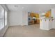 Open kitchen featuring stainless steel appliances, light wood cabinets, and view to breakfast bar at 6625 Pine Siskin Pl, North Las Vegas, NV 89084