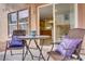 Cozy patio seating area overlooking the backyard, accessible from the kitchen at 6625 Pine Siskin Pl, North Las Vegas, NV 89084