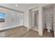 Bathroom with a large shower stall, wood-look flooring, and a separate toilet area at 6643 Tangled Vines Ave, Las Vegas, NV 89139