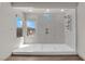 Bathroom showing a large, modern shower stall with sleek hardware and a window at 6643 Tangled Vines Ave, Las Vegas, NV 89139