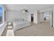 Spacious bedroom with large windows, carpet, and ceiling fan at 6643 Tangled Vines Ave, Las Vegas, NV 89139