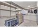 Walk-in closet with custom shelving and hanging rods for ample storage at 6643 Tangled Vines Ave, Las Vegas, NV 89139