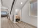 View of a hallway with hardwood floors and decorative alcove at 6643 Tangled Vines Ave, Las Vegas, NV 89139