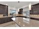 Gourmet kitchen featuring modern appliances and a granite-topped island at 6643 Tangled Vines Ave, Las Vegas, NV 89139