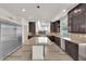 Well-equipped kitchen with granite countertops, stainless appliances, and abundant cabinetry at 6643 Tangled Vines Ave, Las Vegas, NV 89139