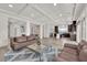 Spacious open-concept living area with seamless access to the dining and kitchen spaces at 6643 Tangled Vines Ave, Las Vegas, NV 89139
