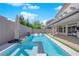 Relaxing pool and spa with a covered patio area and outdoor seating, ideal for enjoying the outdoors at 6643 Tangled Vines Ave, Las Vegas, NV 89139