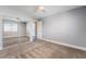 Carpeted bedroom with mirrored closet and neutral paint offers a bright, airy feel at 695 Orbiter Ln, Las Vegas, NV 89148
