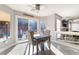 Cozy breakfast nook with views of the pool and outdoor area through the sliding glass doors at 695 Orbiter Ln, Las Vegas, NV 89148