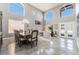 Well-lit dining room with high ceilings and clerestory windows at 695 Orbiter Ln, Las Vegas, NV 89148
