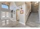 Inviting foyer with high ceilings, tiled floors, and a staircase leading to the upper level at 695 Orbiter Ln, Las Vegas, NV 89148