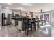 Modern kitchen with stainless steel appliances and breakfast bar at 695 Orbiter Ln, Las Vegas, NV 89148