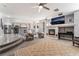 Spacious living room with a fireplace and plush seating at 695 Orbiter Ln, Las Vegas, NV 89148