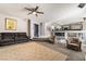 Open-concept living room with cozy seating and kitchen view at 695 Orbiter Ln, Las Vegas, NV 89148