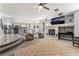 Spacious living room with a fireplace and plush seating at 695 Orbiter Ln, Las Vegas, NV 89148