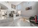 Spacious living room with high ceilings, dining area and elegant décor at 695 Orbiter Ln, Las Vegas, NV 89148