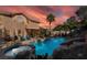Backyard oasis featuring a private pool, spa, and lounge area at 695 Orbiter Ln, Las Vegas, NV 89148
