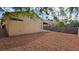 Expansive backyard with gravel landscaping, mature trees and shrubbery, perfect for entertaining guests at 7053 Magic Moment Ln, Las Vegas, NV 89119