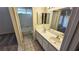 Bright bathroom with double sinks, a large mirror, and a separate tub/shower for added convenience at 7053 Magic Moment Ln, Las Vegas, NV 89119